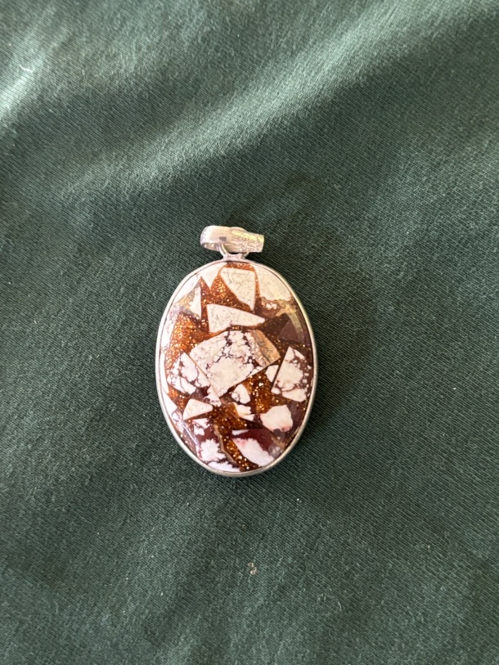 pendant possibly wild horse.